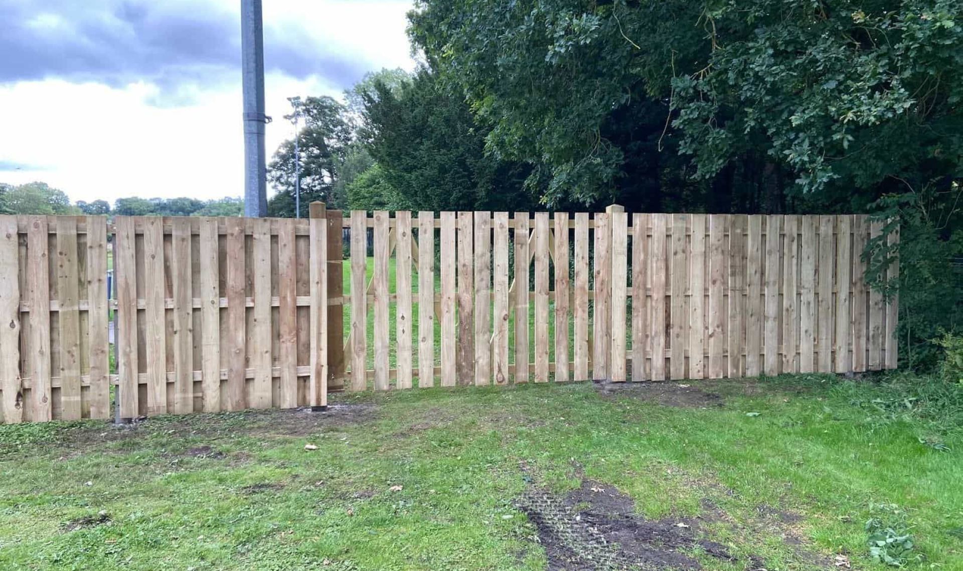 Fencing at amesbury football club. Close up of wooden gate.