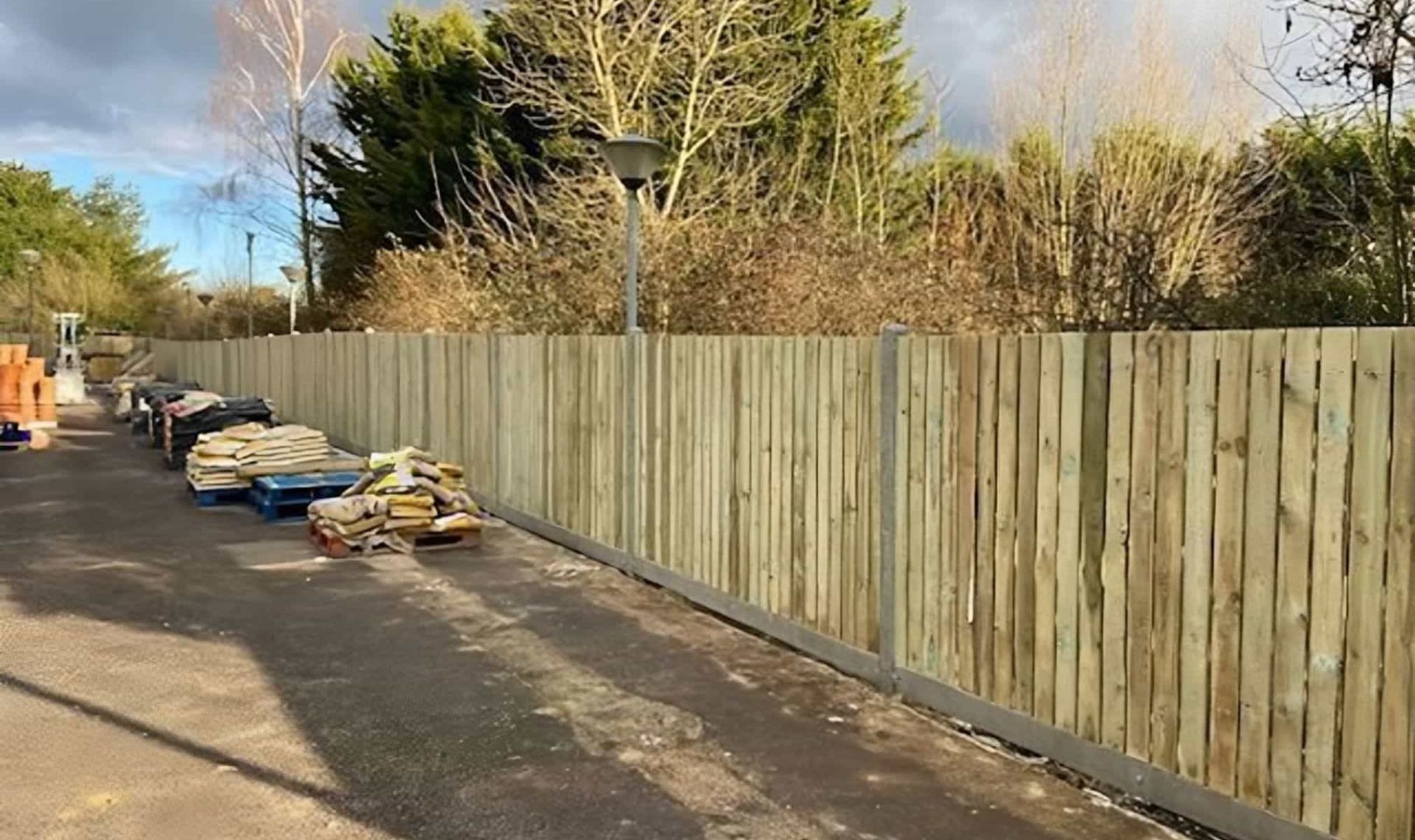 Vertical fence panels installed looking along the fence line.