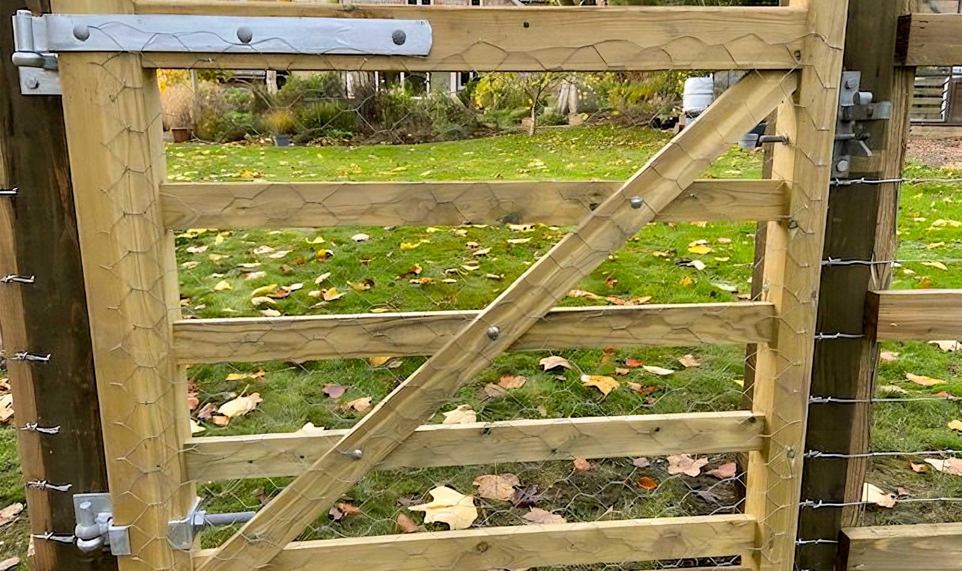 Five bar field gate with wire attached.