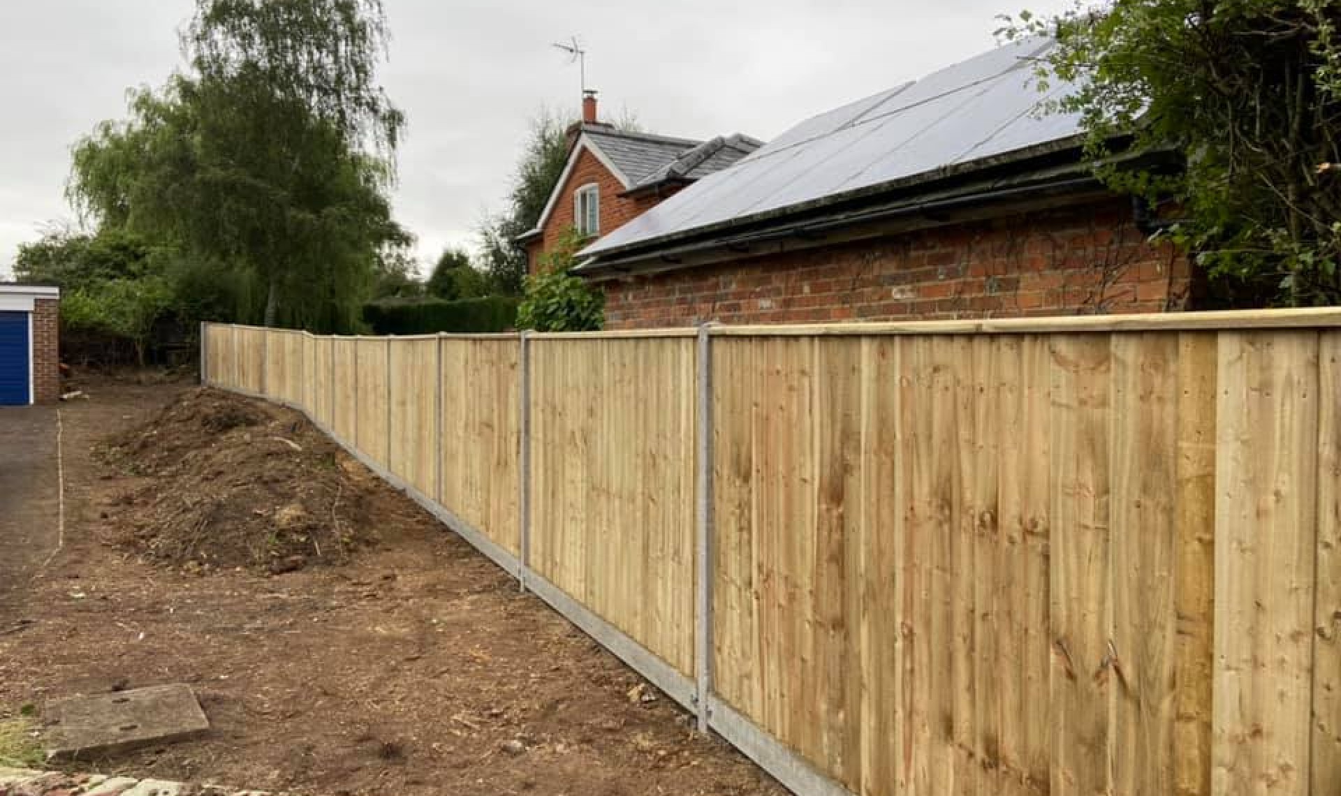 Closeboard fence in amesbury completed looking down the fence line.